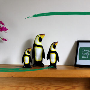 Three hand painted wooden penguin ornaments from Shiny Happy Eco.
