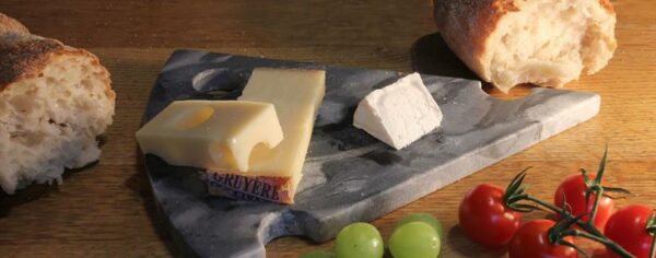 Cheese Board crafted from grey stone. Fair Trade. Cheese slice design.