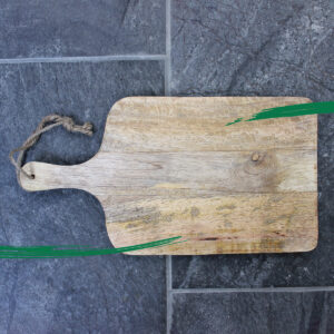 Chopping board made out of Mango wood from Shiny Happy Eco on slate