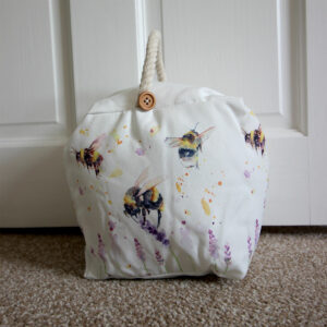 Doorstop with illustrated bees and flowers from Shiny Happy Eco online gift shop