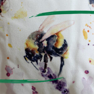 Close up detail of illustrated bee doorstop from Shiny Happy Eco