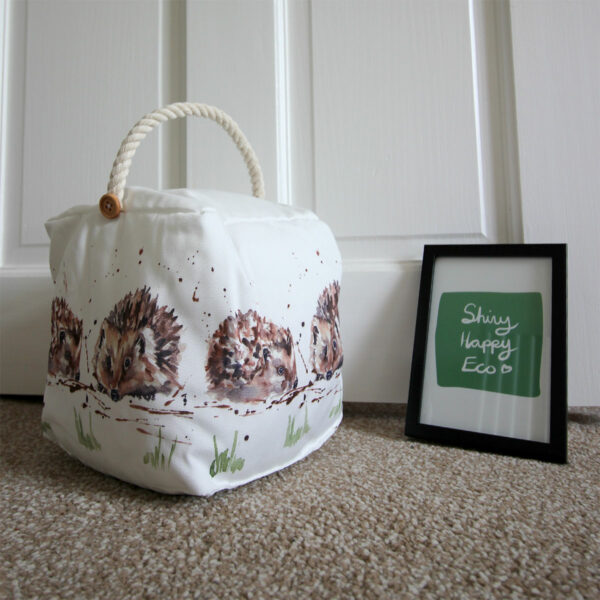 Square fabric door stop with illustrated hedgehogs from Shiny Happy Eco online gift store