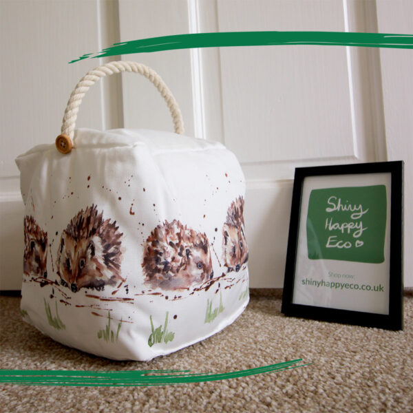 Country styled square fabric doorstop with illustrated hedgehogs from Shiny Happy Eco