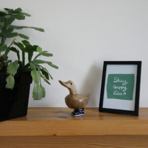 Bamboo Duckling with Black Painted Boots from Shiny Happy Eco on a mantel piece