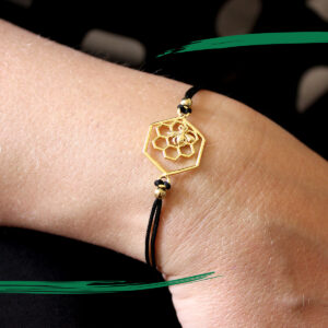 Photograph of Bee on Honeycomb bracelet - Gold colour - From Shiny Happy Eco