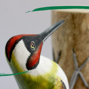 Close up of head of our Wooden Green Woodpecker from Shiny Happy Eco - Hand crafted and hand painted
