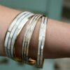 Set of 3 bangles - Pearl coloured shown on a ladies arm.