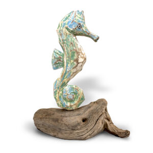 Painted wooden abstract seahorse in shades of green