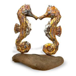 Pair of wooden seahorses shades of orange and brown on driftwood ornament available from Shiny Happy Eco