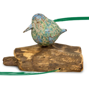 Abstract single bird green and blue colourings on driftwood with available from Shiny Happy Eco.