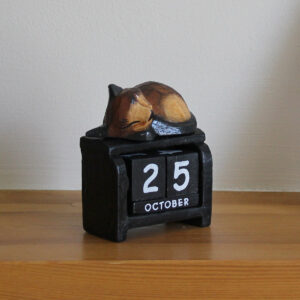 Sleeping cat perpetual calendar - dark brown option on black calendar available from Shiny Happy Eco.