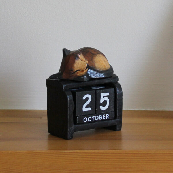 Sleeping cat perpetual calendar - dark brown option on black calendar available from Shiny Happy Eco.