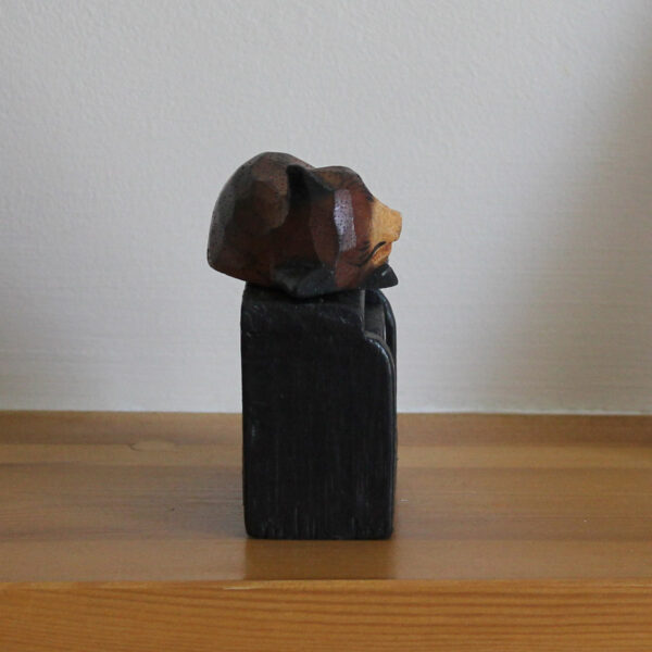 Side view of cat sleeping on block calendar in dark brown on black available from Shiny Happy Eco.