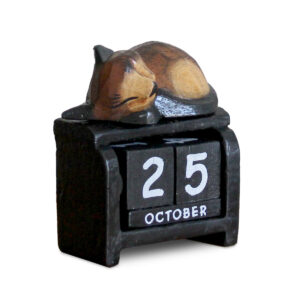 Cat sleeping on calendar ornament in dark brown colourings available from Shiny Happy Eco.