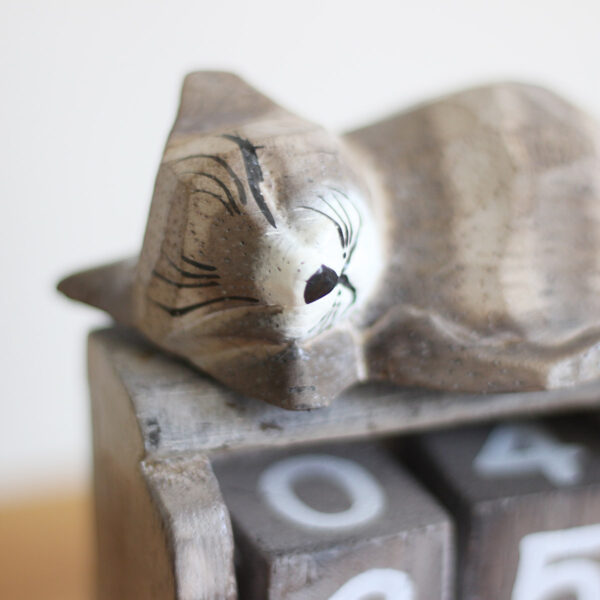 Close up detail of head of Sleeping Cat calendar ornament in light brown colourings available from Shiny Happy Eco.