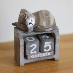 Sleeping Cat calendar ornament in light brown colourings available from Shiny Happy Eco.