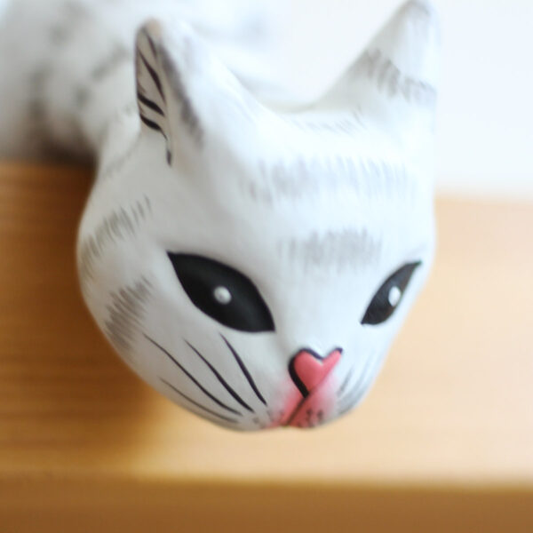Close up of front of head of Cat looking off shelf ornament - Hand painted white and grey cat ornaments available to buy from Shiny Happy Eco.