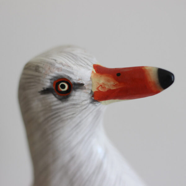 Close up of the head of a Wooden Painted Seagull ornament - hand made and hand painted. Available from Shiny Happy Eco.