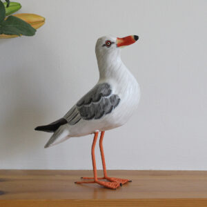 Wooden Painted Seagull ornament on shelf - hand made and hand painted. Available from Shiny Happy Eco.