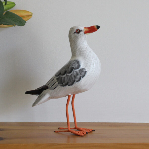 Wooden Painted Seagull ornament on shelf - hand made and hand painted. Available from Shiny Happy Eco.