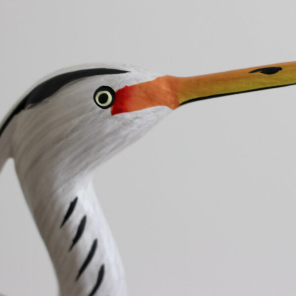 Close up of head of Wooden Heron ornament handmade and hand painted available from Shiny Happy Eco.