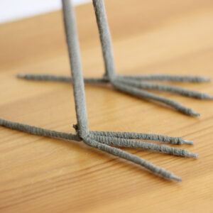 Close up of feet of Wooden Heron ornament handmade and hand painted available from Shiny Happy Eco.
