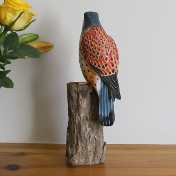 Handmade and hand painted Wooden Kestrel Ornament on mantelpiece available from Shiny Happy Eco