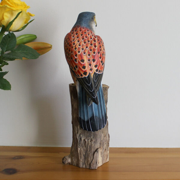 Rear view of handmade Wooden Kestrel Ornament on mantelpiece available from Shiny Happy Eco