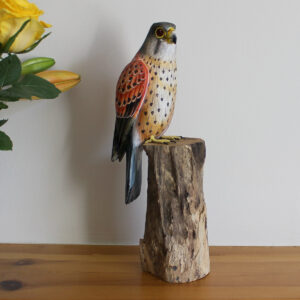 Hand made and hand painted Wooden Kestrel Ornament on mantelpiece available from Shiny Happy Eco
