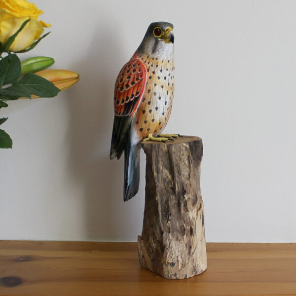 Hand made and hand painted Wooden Kestrel Ornament on mantelpiece available from Shiny Happy Eco