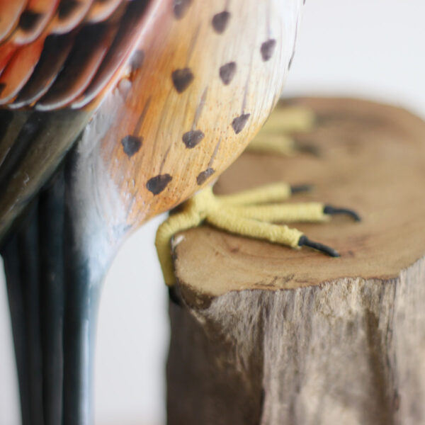Close up of feet of Wooden Kestrel Ornament on mantelpiece available from Shiny Happy Eco