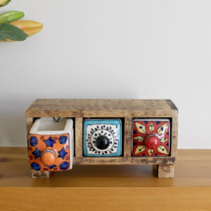 Wooden mini chest of 3 colourful ceramic drawers with first drawer open from Shiny Happy Eco