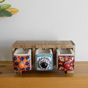 Wooden mini chest of 3 colourful ceramic drawers with three drawers open from Shiny Happy Eco