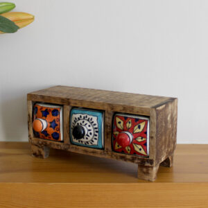 Angled view of Wooden mini chest of 3 colourful ceramic drawers from Shiny Happy Eco