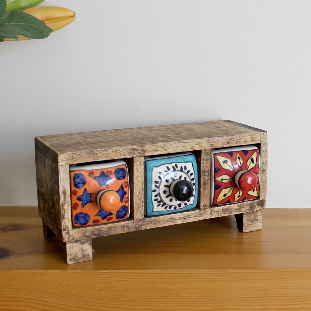 Angled view of Wooden mini chest of 3 colourful ceramic drawers available from Shiny Happy Eco