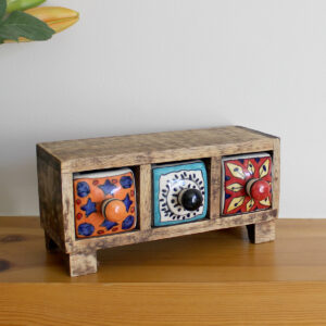 Angled view of Wooden mini chest of 3 colourful ceramic drawers available from Shiny Happy Eco