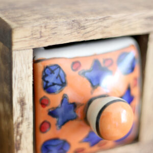 Close up of one drawer from Wooden mini chest of 3 colourful ceramic drawers from Shiny Happy Eco