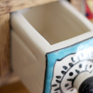 Close up of open drawer in Wooden mini chest of 3 colourful ceramic drawers from Shiny Happy Eco