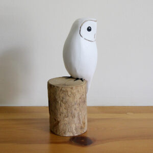 Wooden Snowy Owl ornament on shelf hand carved and painted available from Shiny Happy Eco