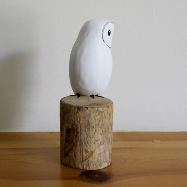 Side view of Wooden Snowy Owl ornament hand carved and painted from Shiny Happy Eco