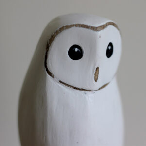 Close up of head of Wooden Snowy Owl ornament hand carved and painted from Shiny Happy Eco