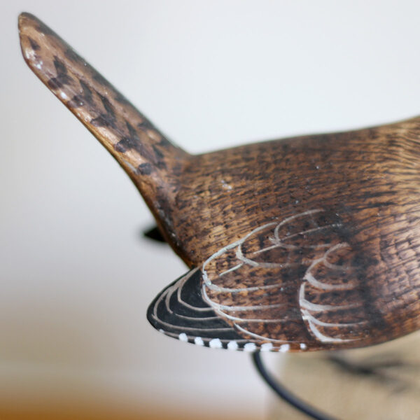 Close up of tail of Hand carved and painted Wooden Wren Ornament on driftwood available from Shiny Happy Eco.